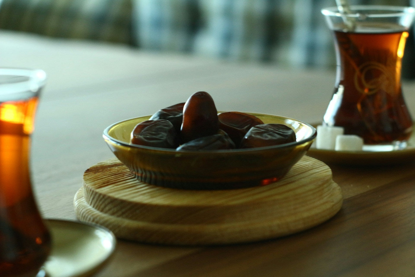 Assorted dates served with tea on a tray