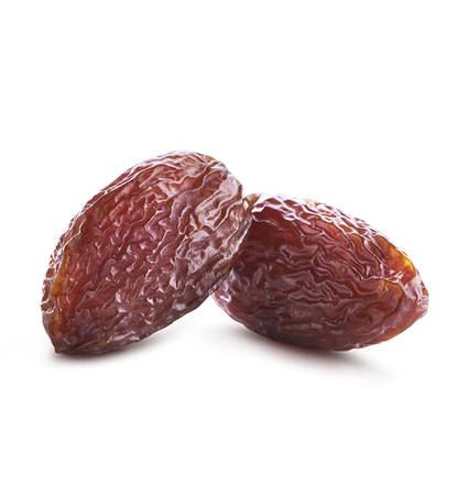 Two dried Medjool dates on a white background